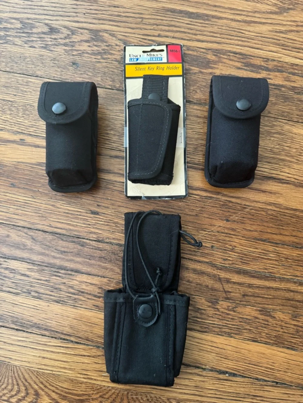 2 Pepper spray holders, 1 tactical key holder, 1 tactical radio holder.